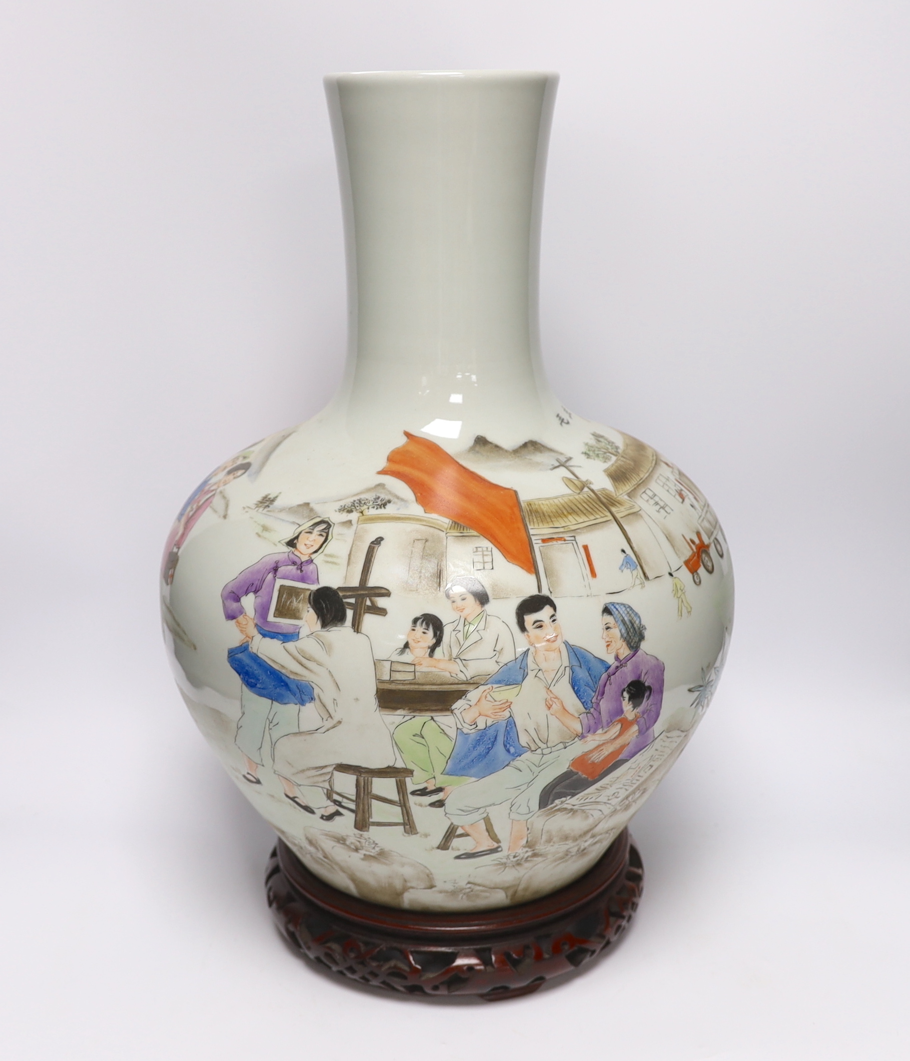 A Chinese Cultural Revolution style enamelled porcelain vase on stand, 50cm high including stand
